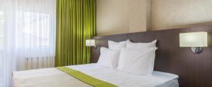 Postel nebo postele na pokoji v ubytování Hotel Alex