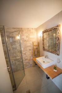 a bathroom with a sink and a shower at Skopelitis Village in Katapola