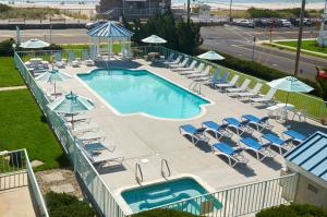 an overhead view of a pool with chairs and umbrellas at Sea Crest Inn in Cape May