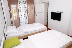 Posteľ alebo postele v izbe v ubytovaní Apartmani Nova