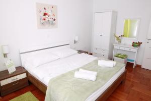 Posteľ alebo postele v izbe v ubytovaní Apartmani Nova