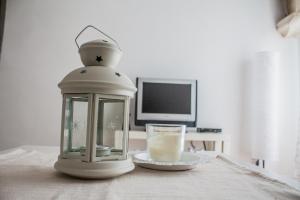 a lantern sitting on a table with a candle and a plate at Dalmato in Split