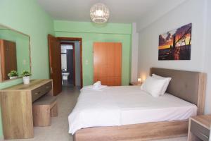 Postel nebo postele na pokoji v ubytování Bourlis Apartments