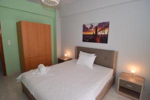 Postel nebo postele na pokoji v ubytování Bourlis Apartments