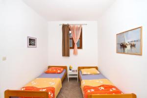 Postel nebo postele na pokoji v ubytování Apartment Center Marija
