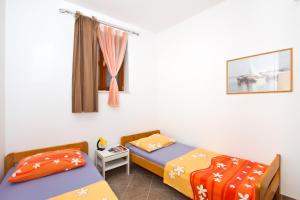 Postel nebo postele na pokoji v ubytování Apartment Center Marija