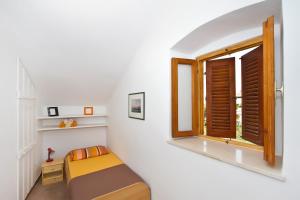 Postel nebo postele na pokoji v ubytování Apartment Center Marija
