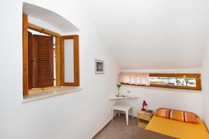 Postel nebo postele na pokoji v ubytování Apartment Center Marija