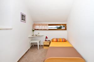 Postel nebo postele na pokoji v ubytování Apartment Center Marija