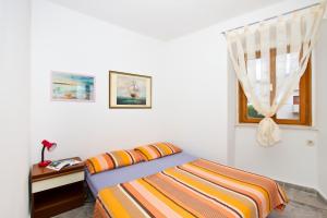Postel nebo postele na pokoji v ubytování Apartment Center Marija