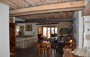 a kitchen and dining room with a table and chairs at Le Chalande in Autrans