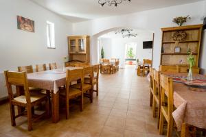 a dining room with a table and chairs at Brigadéros Vendégház in Siklós +22 photos