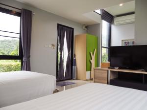 เตียงในห้องที่ The Focus Khaoyai Resort