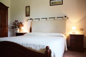 Кровать или кровати в номере Agriturismo Guparza