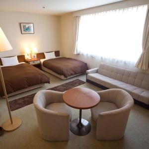 Postel nebo postele na pokoji v ubytování Utazu Grand Hotel
