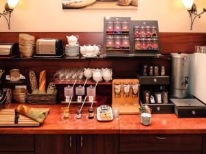 a kitchen counter with utensils and appliances on it at Hotel Europa in Bamberg