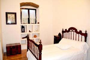 Ένα ή περισσότερα κρεβάτια σε δωμάτιο στο Casa Emerenciana