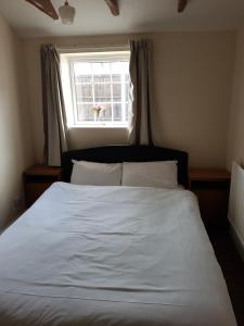 Voodi või voodid majutusasutuse Oak Cottage toas