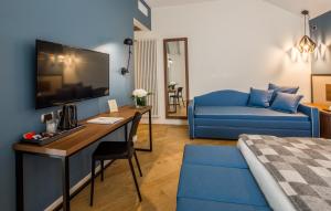 TV a/nebo společenská místnost v ubytování Best Western Hotel Metropoli