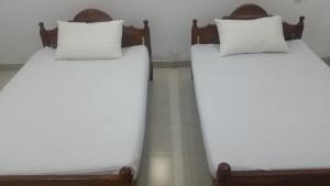 Letto o letti in una camera di Sunhill Lake Tourist Rest