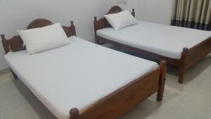 Letto o letti in una camera di Sunhill Lake Tourist Rest