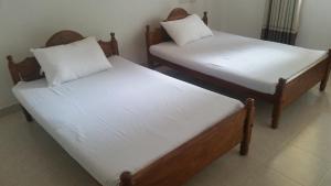 Letto o letti in una camera di Sunhill Lake Tourist Rest