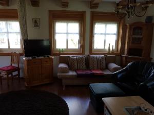Posezení v ubytování Ferienwohnung Zum Heuschober