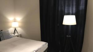 Posteľ alebo postele v izbe v ubytovaní Widok na Mazury Apartament przy Porcie