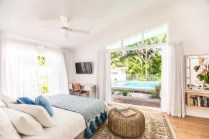 Postel nebo postele na pokoji v ubytování Pineapple Petes Beach House