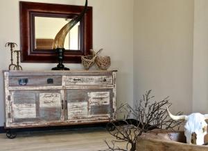 a mirror on top of a dresser in a room at Vallegrande Nature Resort by Geocharme in Cefalù