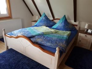Postel nebo postele na pokoji v ubytování Ferienwohnung Zum Heuschober