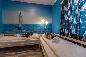 Postel nebo postele na pokoji v ubytování Apartments Faro & Mondo