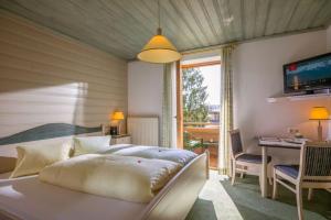 Postel nebo postele na pokoji v ubytování Pension Garni Appartement Ortner