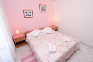Postel nebo postele na pokoji v ubytování Apartments Pataj