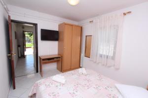 Postel nebo postele na pokoji v ubytování Apartments Pataj