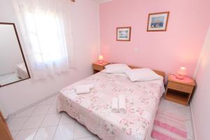 Postel nebo postele na pokoji v ubytování Apartments Pataj