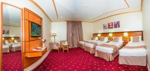 Postel nebo postele na pokoji v ubytování Amjad Al Deafah Hotel + 37 fotografií