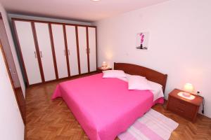 Postel nebo postele na pokoji v ubytování Apartments Pataj