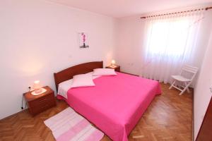 Postel nebo postele na pokoji v ubytování Apartments Pataj