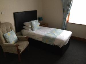 Кровать или кровати в номере Woodlands Guest House