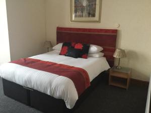 Кровать или кровати в номере Woodlands Guest House