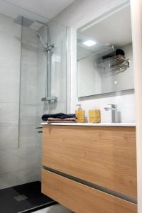 a bathroom with a sink and a shower at Tossa Unique Moments Apartment in Tossa de Mar