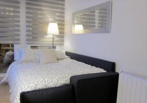 Ένα ή περισσότερα κρεβάτια σε δωμάτιο στο Tossa Unique Moments Apartment