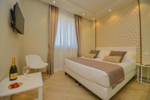 Posteľ alebo postele v izbe v ubytovaní Hotel Villa Garuti