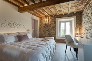 A bed or beds in a room at Relais Ginevra