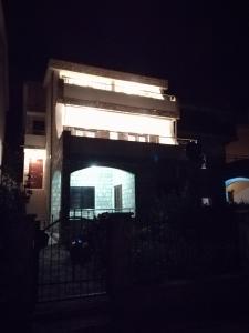 a building at night with lights on it at Apartments Kuc in Bar