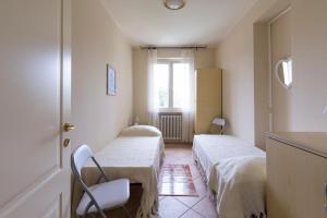 Posteľ alebo postele v izbe v ubytovaní Villetta Nico Sirmione