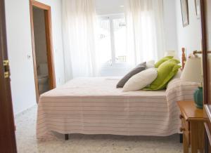 מיטה או מיטות בחדר ב-Apartamento Calle Calzada