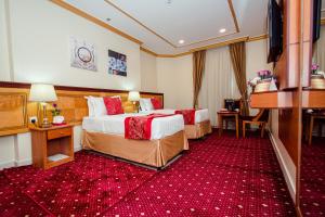 Postel nebo postele na pokoji v ubytování Sama Al Deafah Hotel