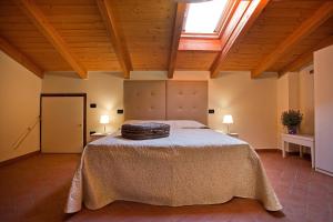 a bedroom with a bed and a skylight at Tenuta San Giovanni Lucca in Lucca